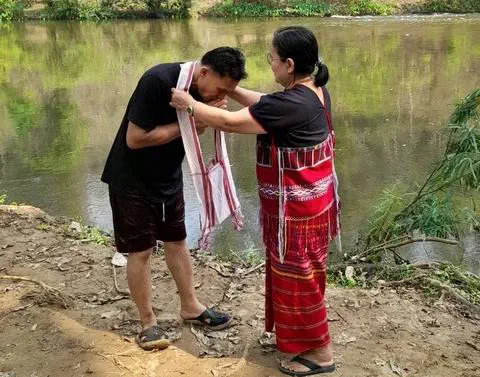 Pansak’s Christian sister-in-law gives Pansak a gift in celebration of his baptism.